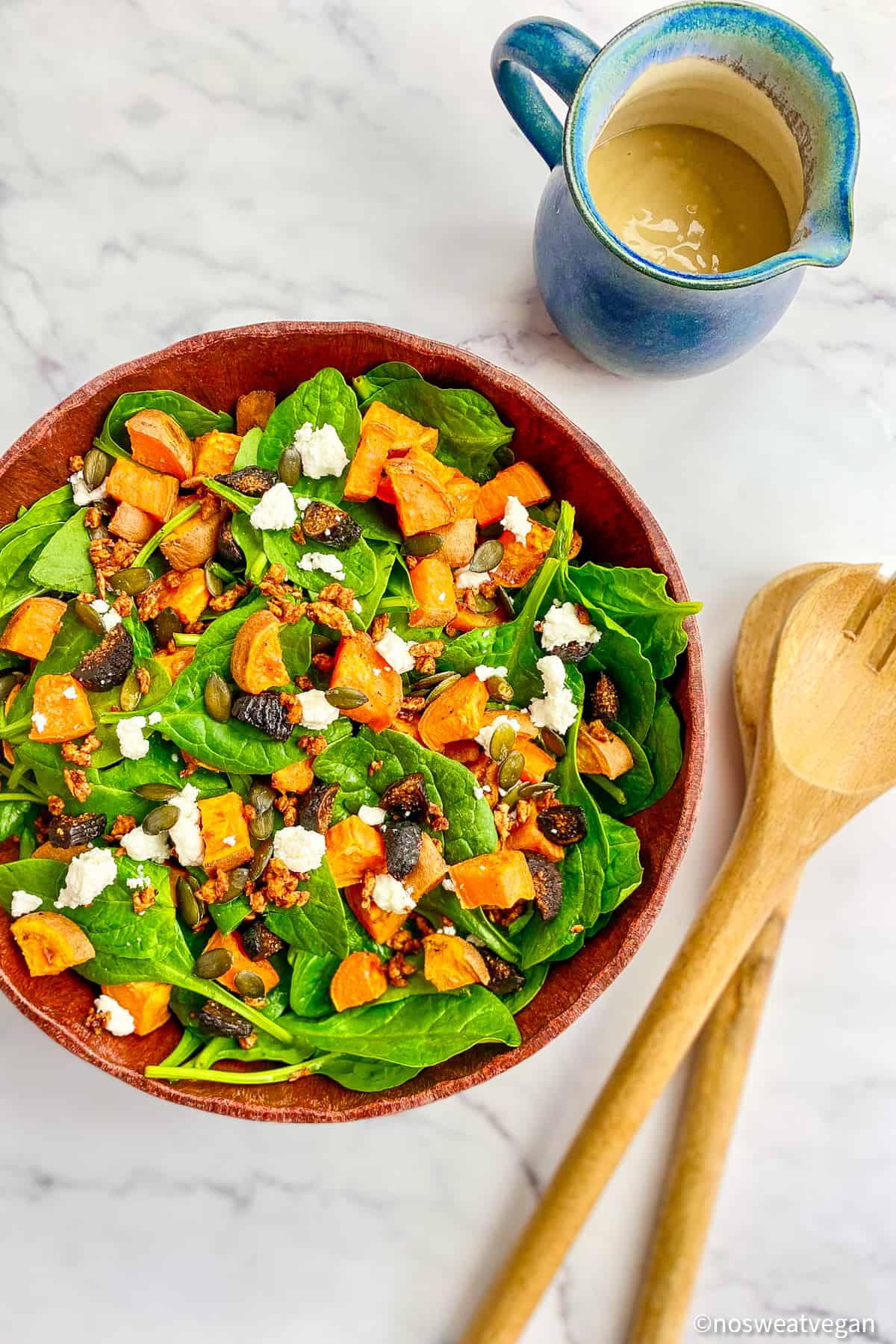 Sweet potato spinach salad in a bowl.