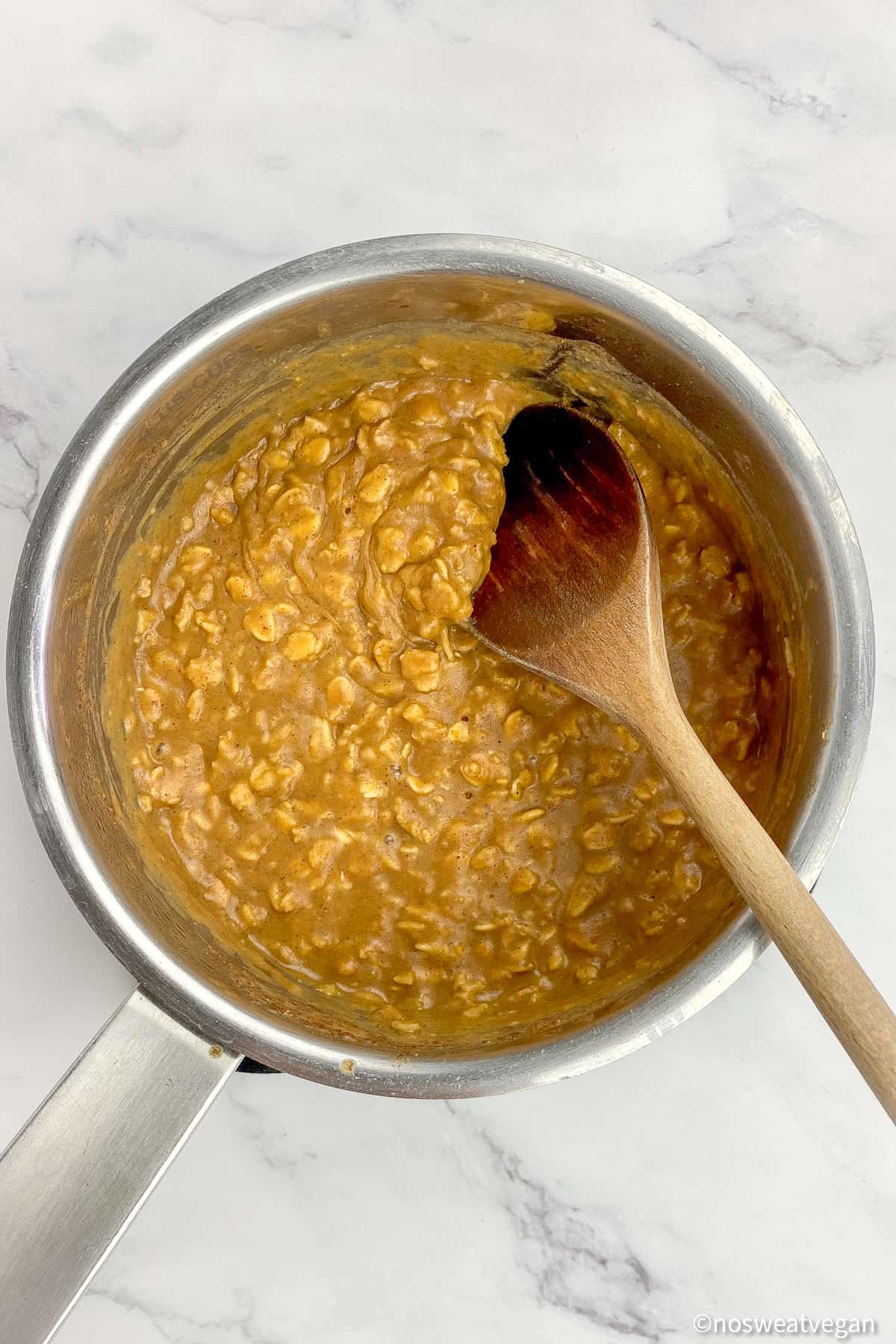 Pumpkin spice oatmeal cooked in a pot.