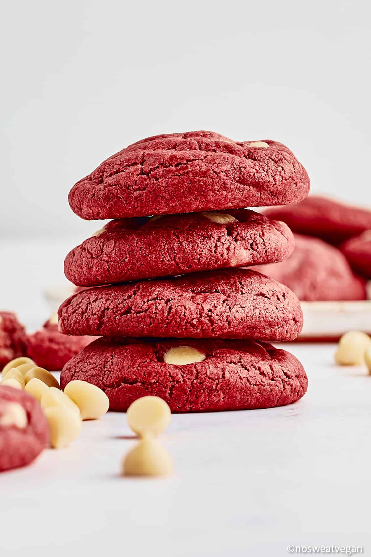 Vegan red velvet cookies stacked.