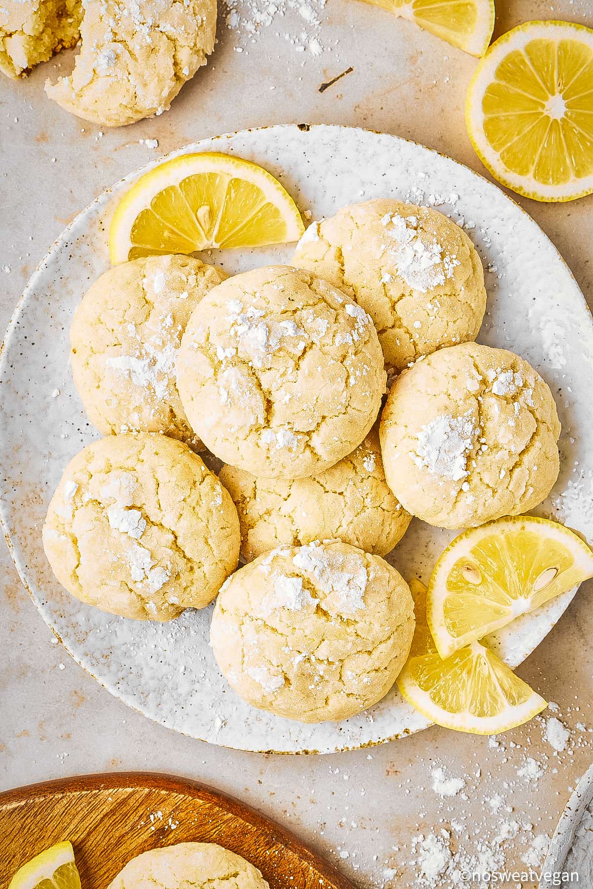 Vegan lemon crinkle cookies on a plate.