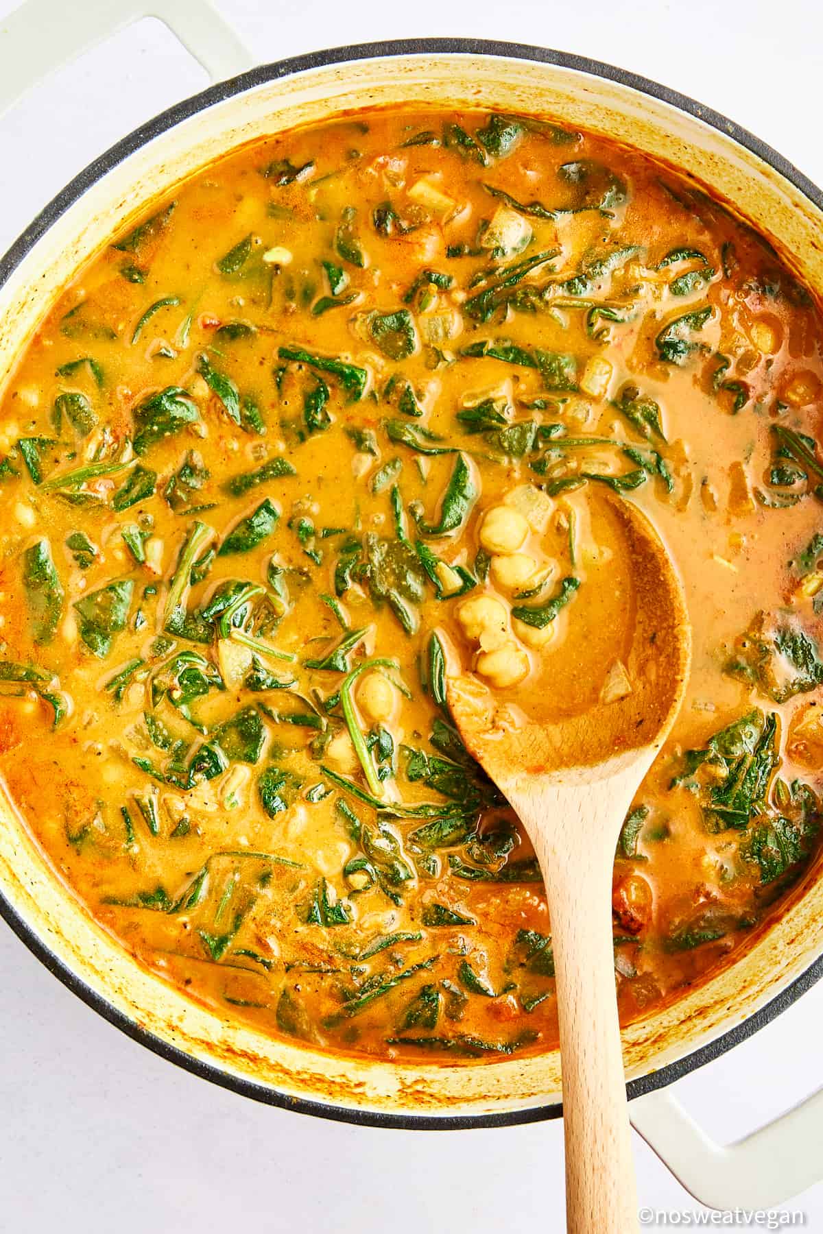 Chickpea and spinach curry in a pot.