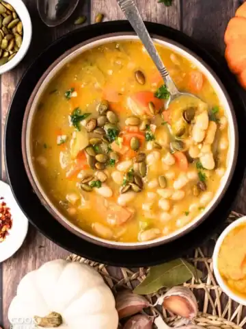 Pumpkin white bean soup in a bowl.