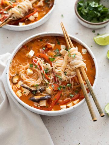 Thai Red Curry Soup in a bowl with chopsticks.